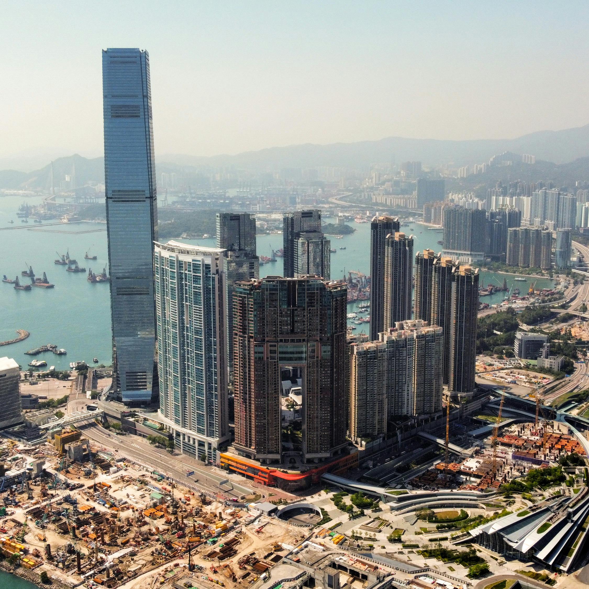 Breathtaking aerial shot of Hong Kong's skyline, capturing skyscrapers and bustling harbor.
